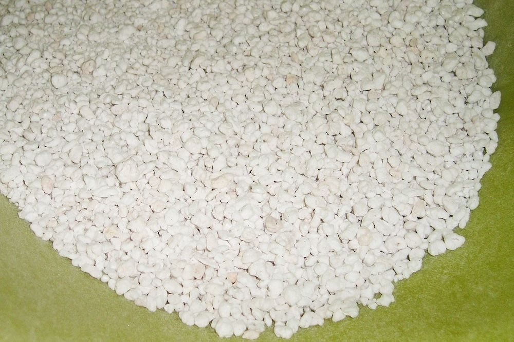 perlite spread out on a yellow surface