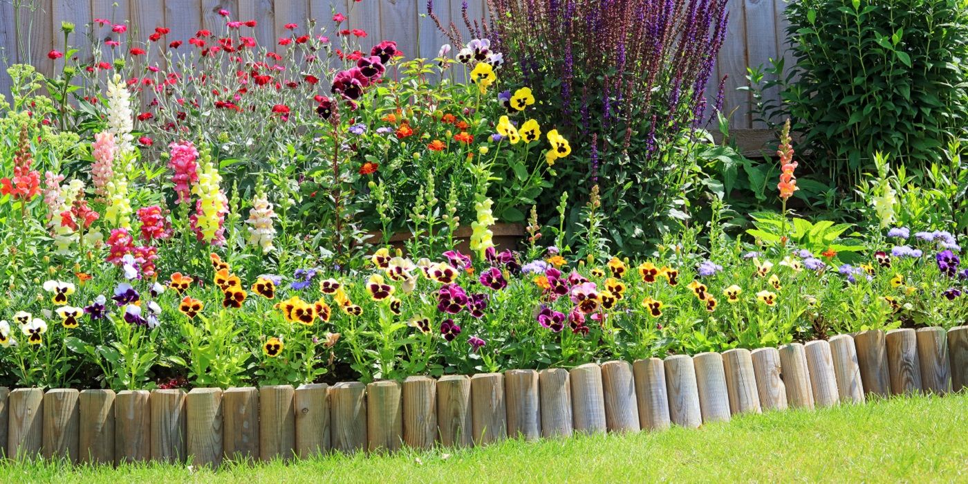 Garden border made of wooden pegs