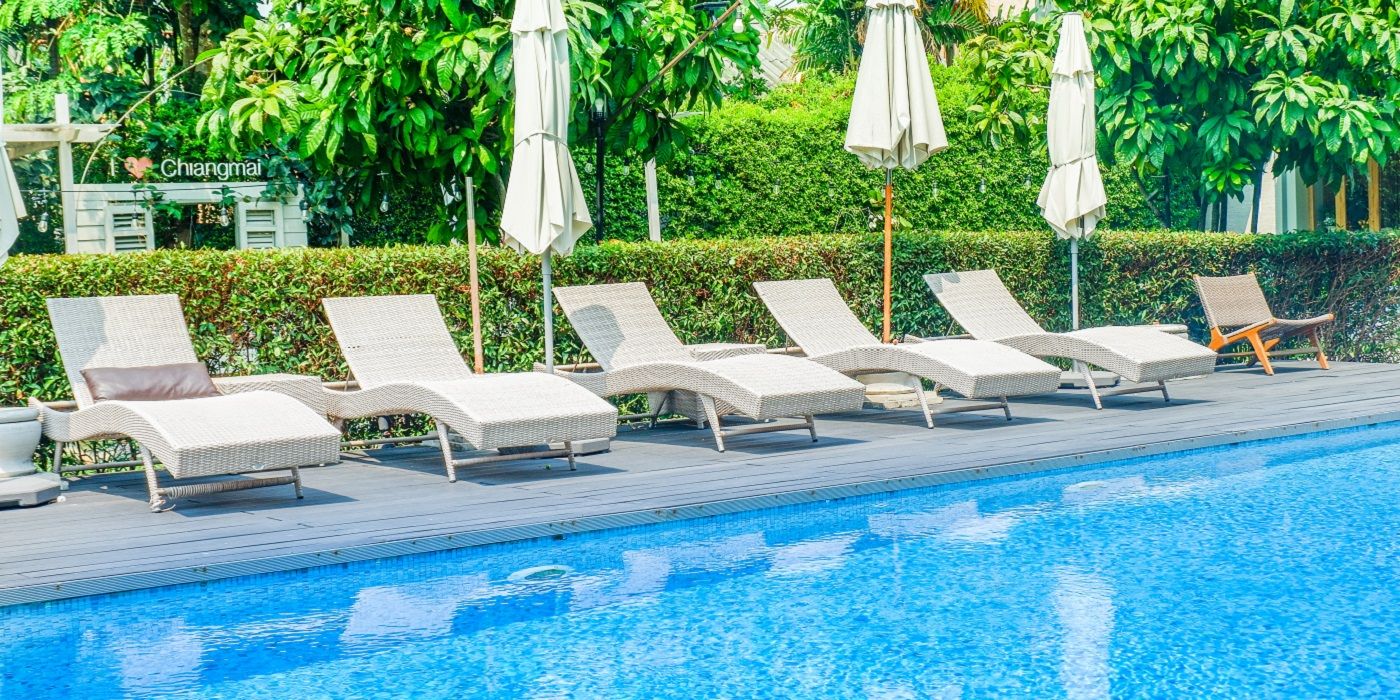 Create the Ultimate Vacation Vibe in Your Backyard Pool
