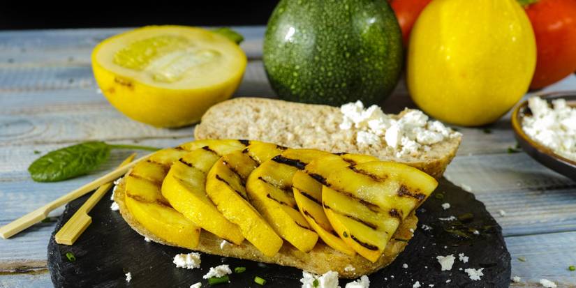 Yellow squash with grill marks on a sandwich 